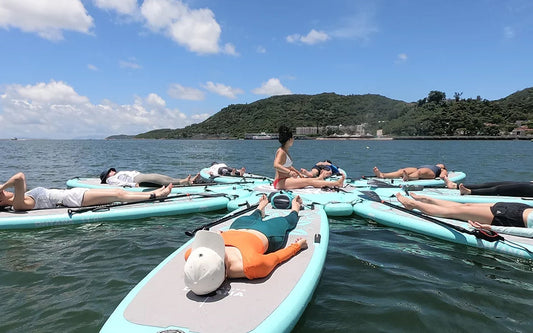 The proper position to sit on a paddle board